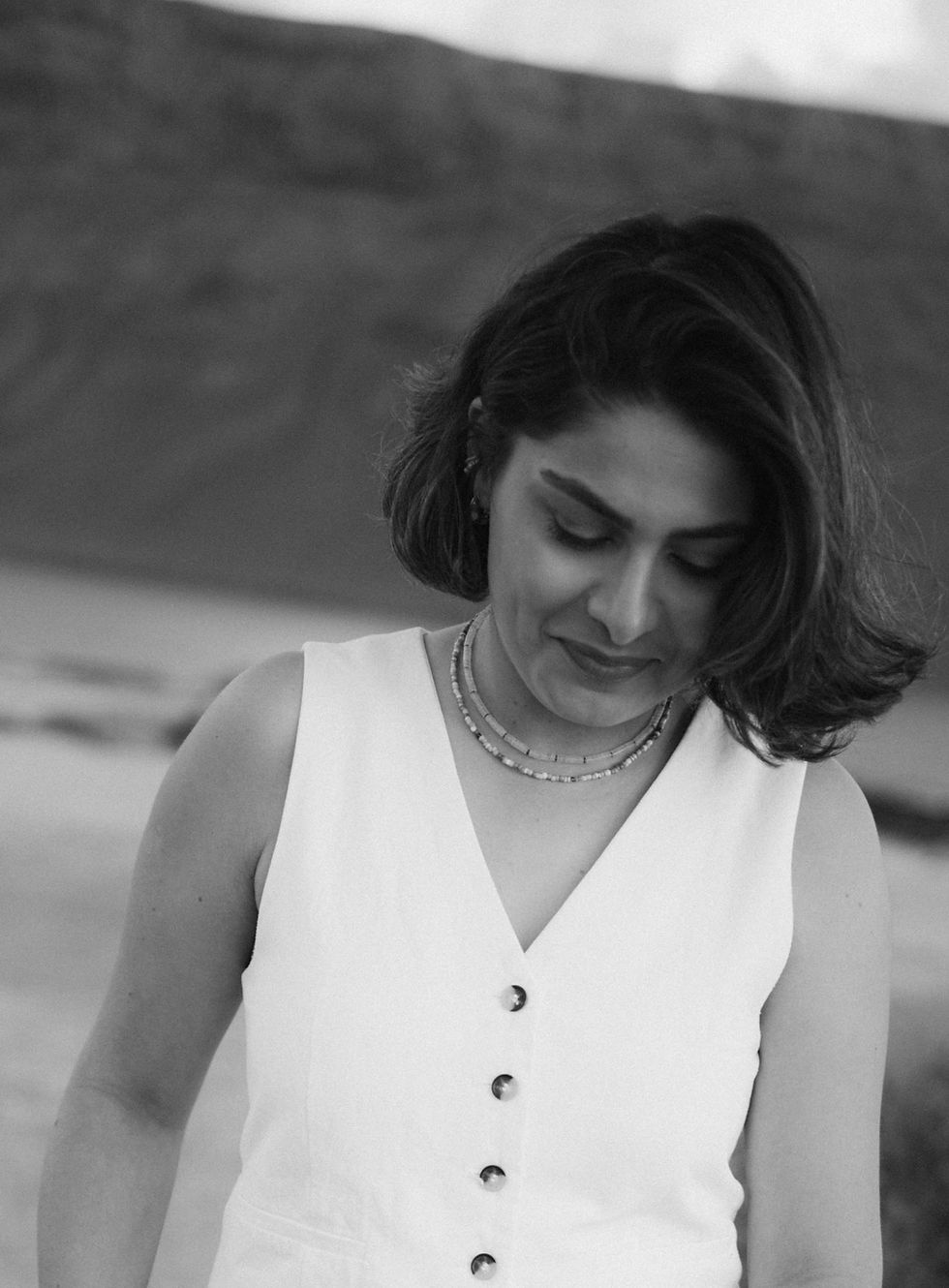 Natural portrait of wedding photographer Nazanin Danai smiling.