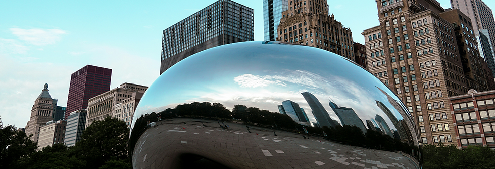 A large shiny ball sitting in front of a