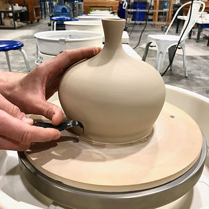 Trimming a 3 pound vase thrown on the potter's wheel.
