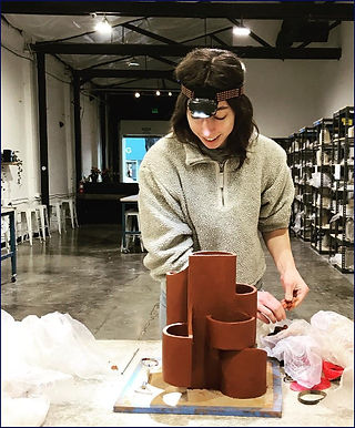 Bailey building a ceramic lamp