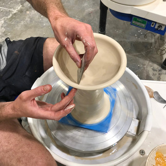 Forming a drinking vessel with a rib on the wheel.