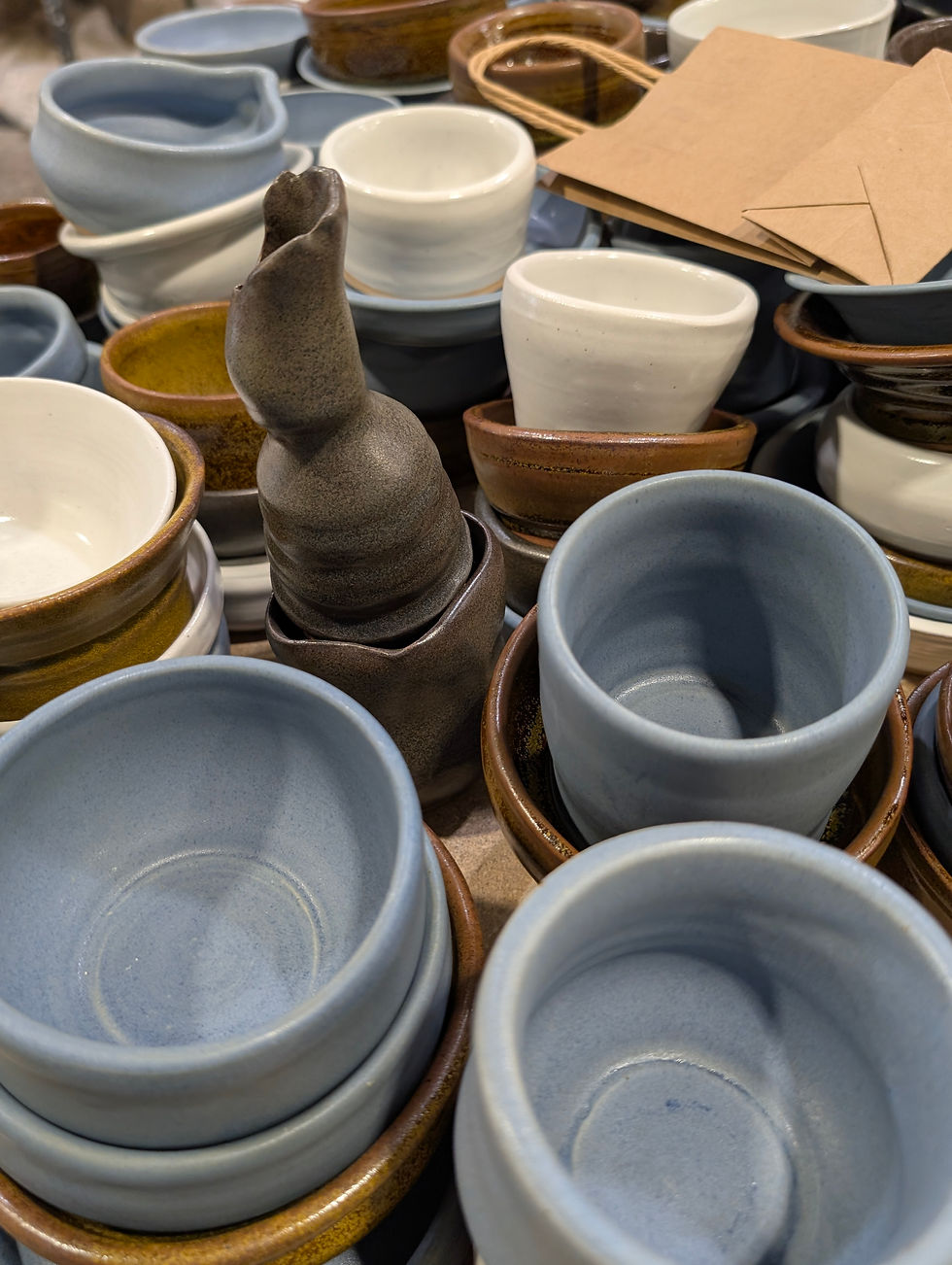 A variety of One-Time Potter's Wheel pieces out of the kiln and ready for packaging.