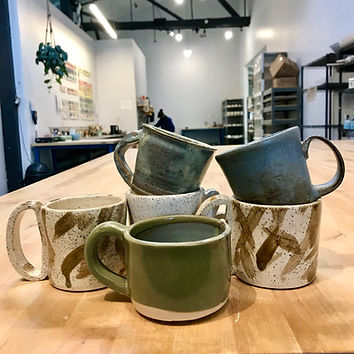 A set of mugs made by a student in Clay Drinking Vessels.