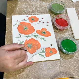 Designing poppies with underglaze