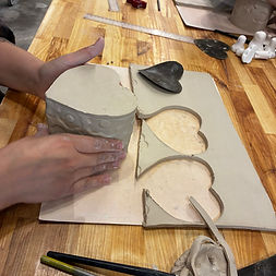 Placing the bottom on the clay heart box