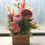 Thumbnail: Cottage garden crate, pink flower arrangement 
