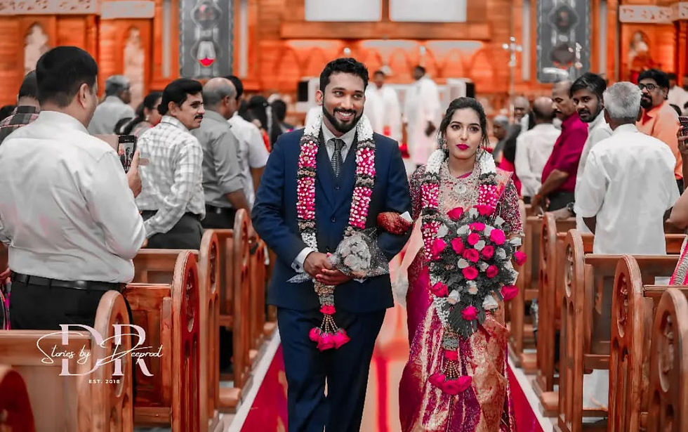 Eye-level view of a joyful south indian
family posing together outdoors
