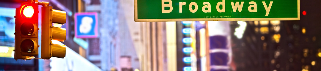 Broadway sign and red stop light in New 