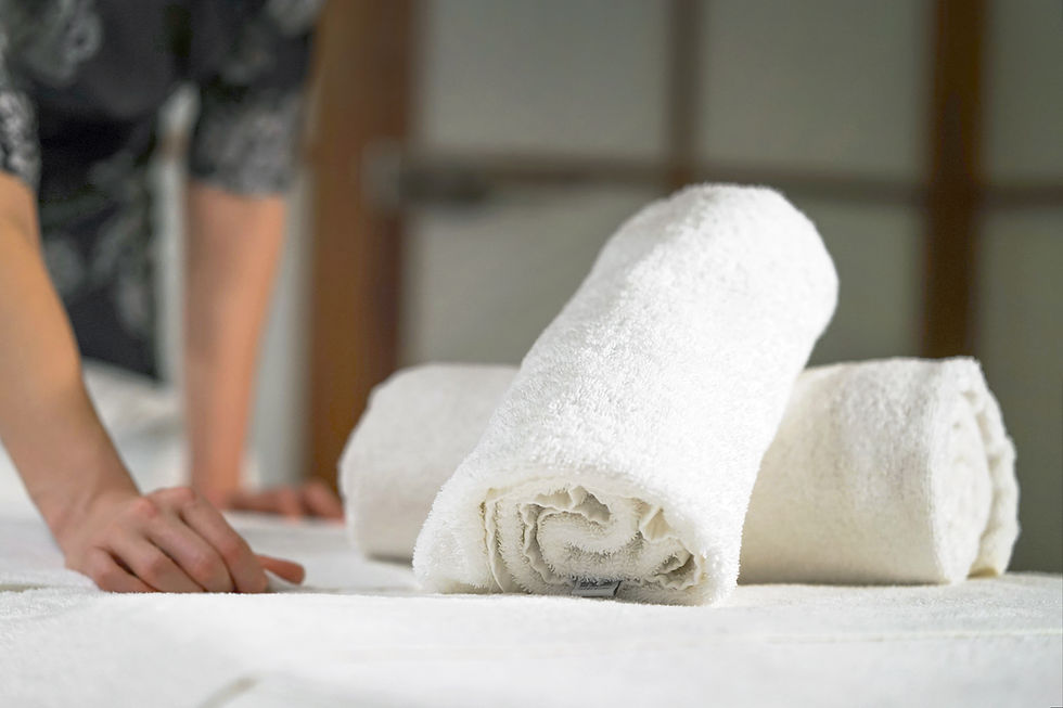 White towels and clean bedsheets for housekeeping