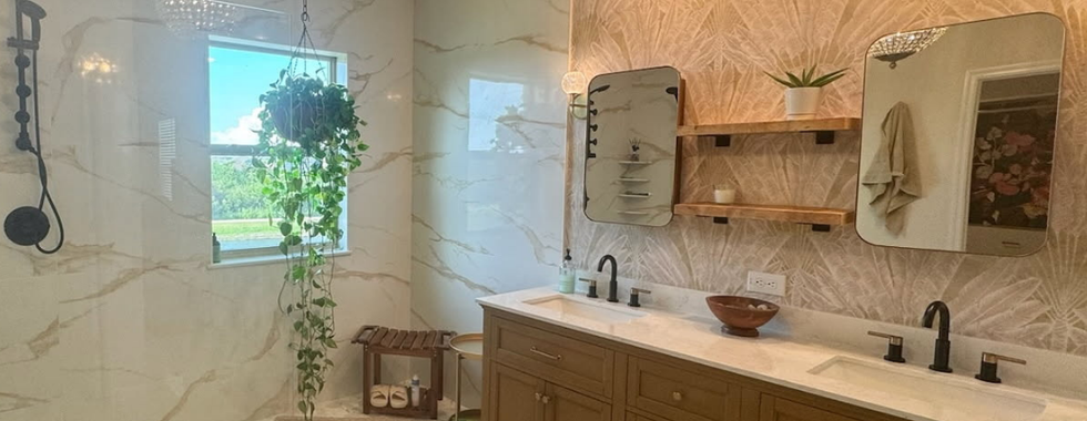 Spa-inspired Feng Shui bathroom with warm lighting and plant decor to enhance relaxation and flow