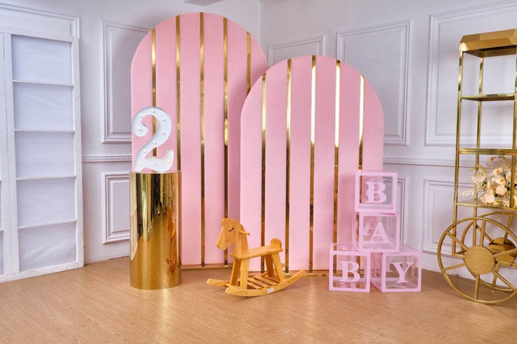 Pink velvet arches 2 m and 1.8 m with gold plinths and birthday décor for 2-year-old Adelaide