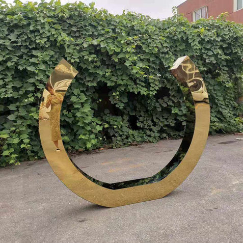 Close-up of Golden Lucky Shoe Backdrop styled with neon signage and themed decorations