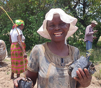 Community-member-very-happy-with-the-trees-thay--SEED-has-provided-.jpg