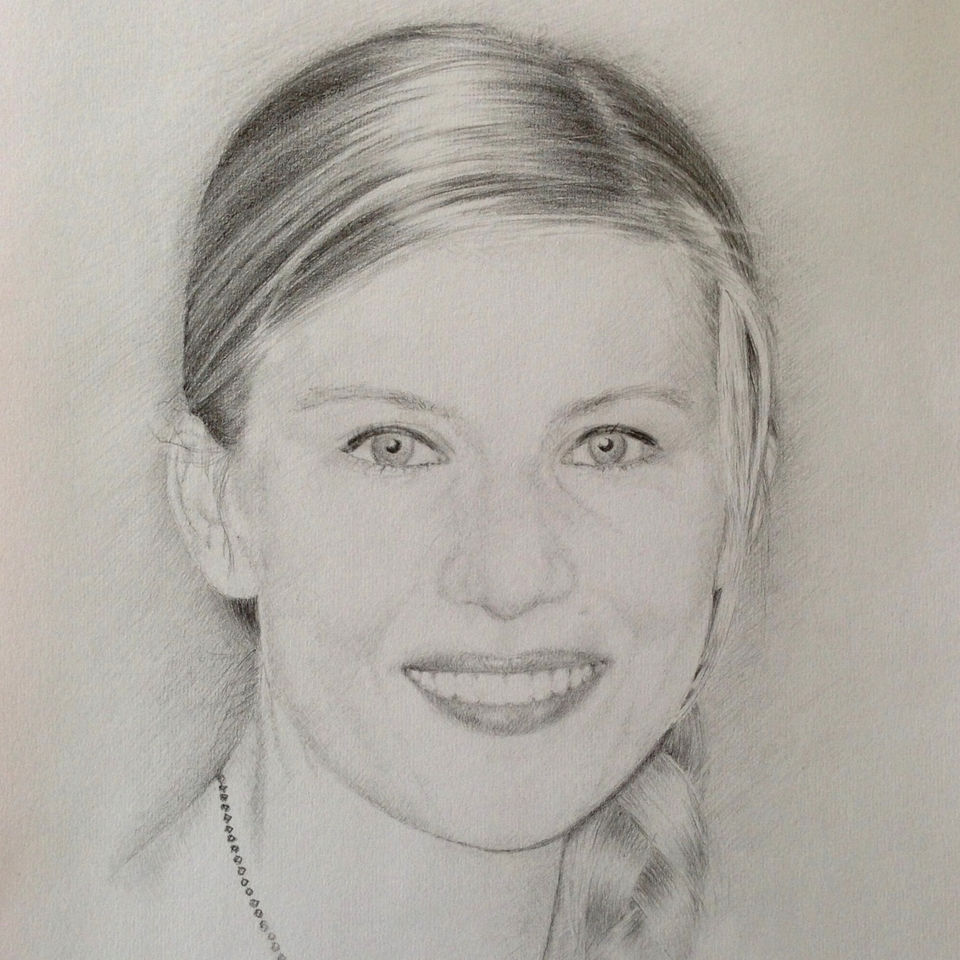 A graphite pencil portrait of a beautiful young woman smiling
