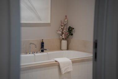 Moody bathroom interior with a freestanding bathtub, property photography for a Dublin listing