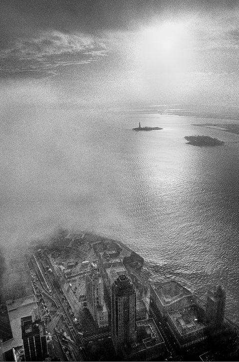 Vertical black and white aerial view of Statue of Liberty