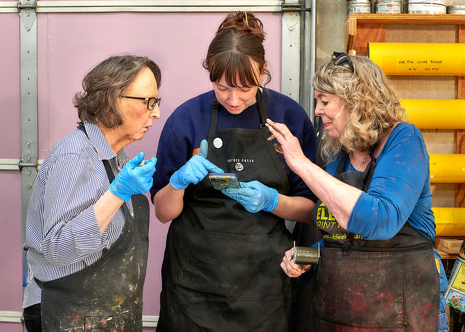 Artist and printers review photos of prints