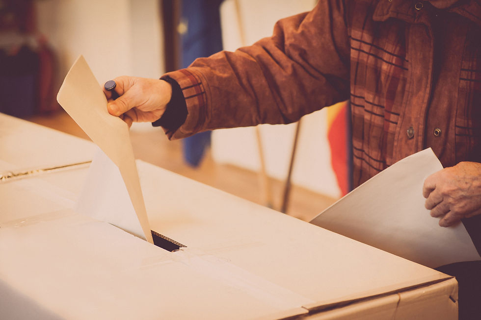Person-voting-at-polling-station-636865726_1258x838.jpeg