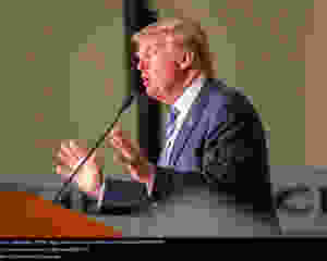President Trump speaking at a podium