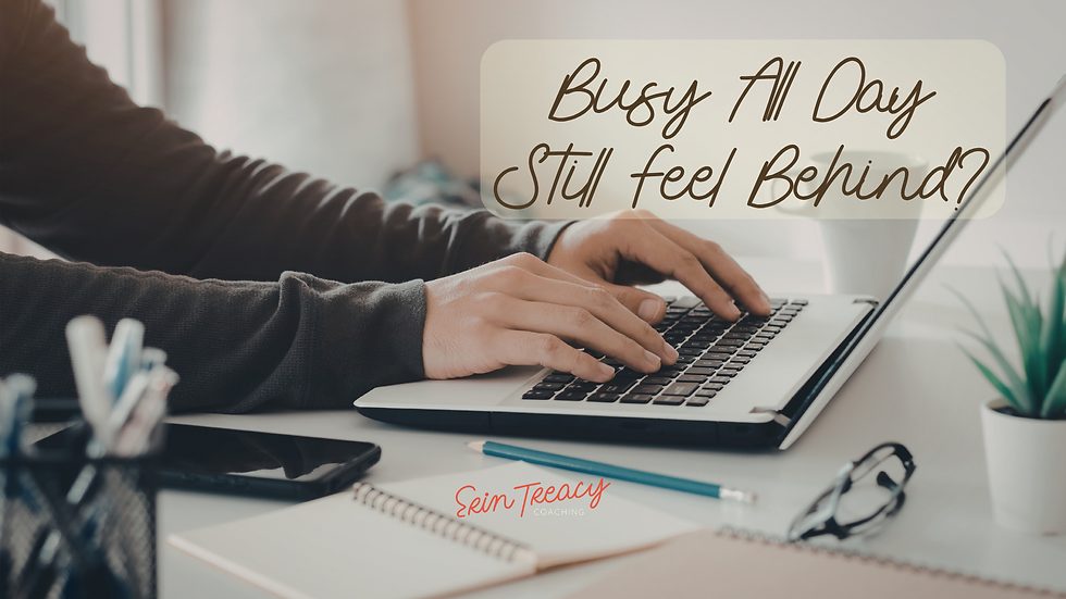 Hands typing on a laptop with notebooks and glasses on a desk. Text reads "Busy All Day, Still Feel Behind?". Erin Treacy Coaching logo.