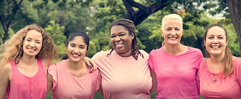 Group of diverse women in pink clothing showing support for breast cancer awareness and areola restoration by Hair Ink SMP Gold Coast