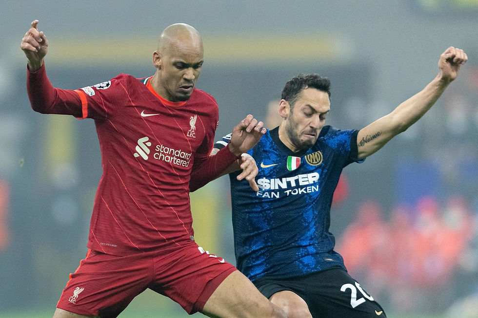 Mohamed Salah and Roberto Firmino score late goals to lift Liverpool to a 2-0 victory over Inter M.