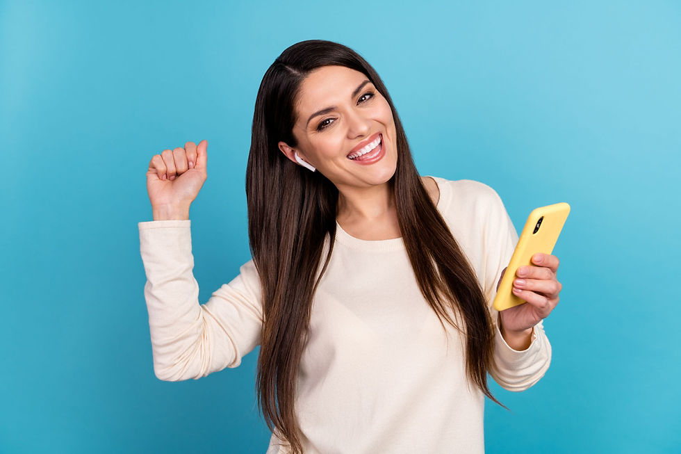 Happy woman listening to her AirPods while holding an iPhone X