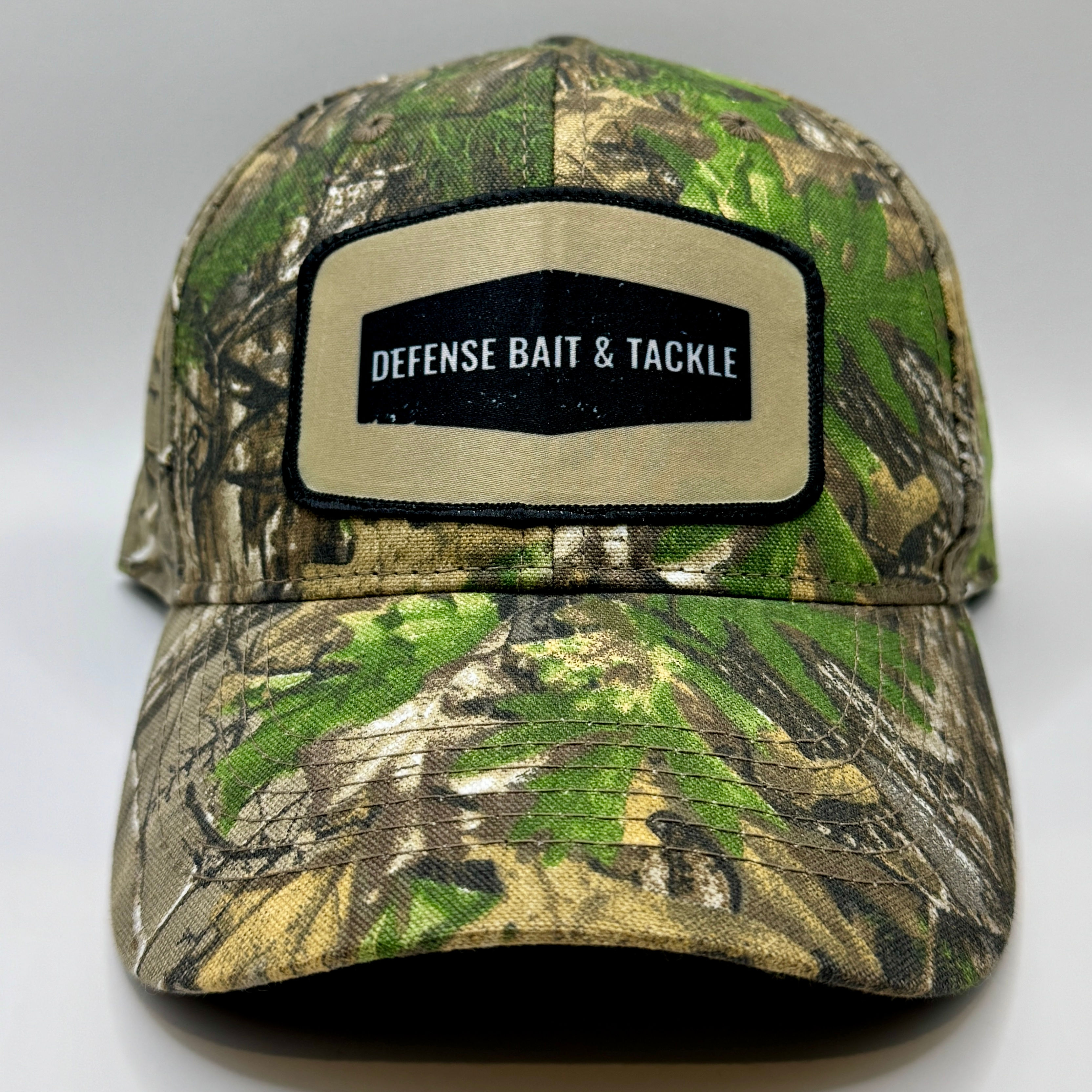 Defense Bait and Tackle Logo Fishing Hat- Real Tree Camo