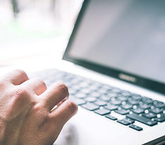 Typing on a laptop