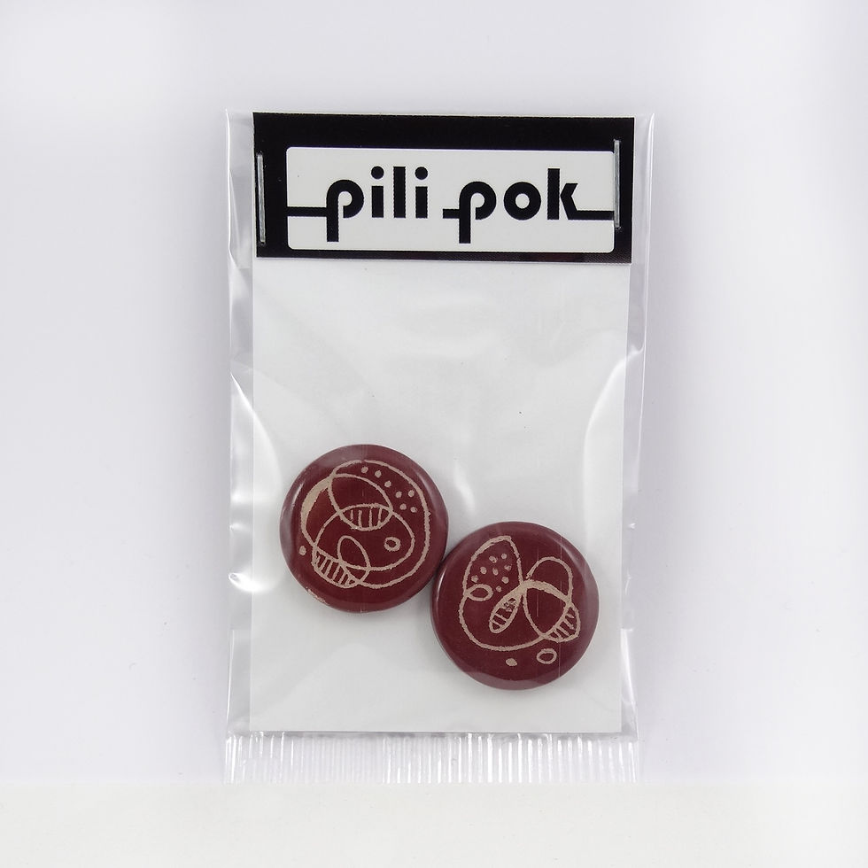 féves rondes en céramique artisanales rouge graphisme dessin