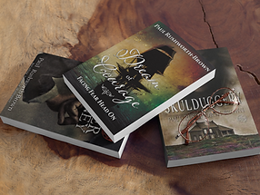 Three books on a table novel Dream of Courage_ Facing Fear Head On sits on top
