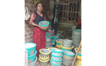 Beneficiary Woman Successfully Managing a Flowerpot Business