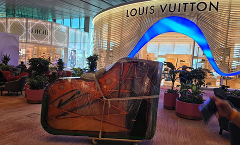 Grand piano moving service at luxury retail mall Singapore by Jie Transport Service