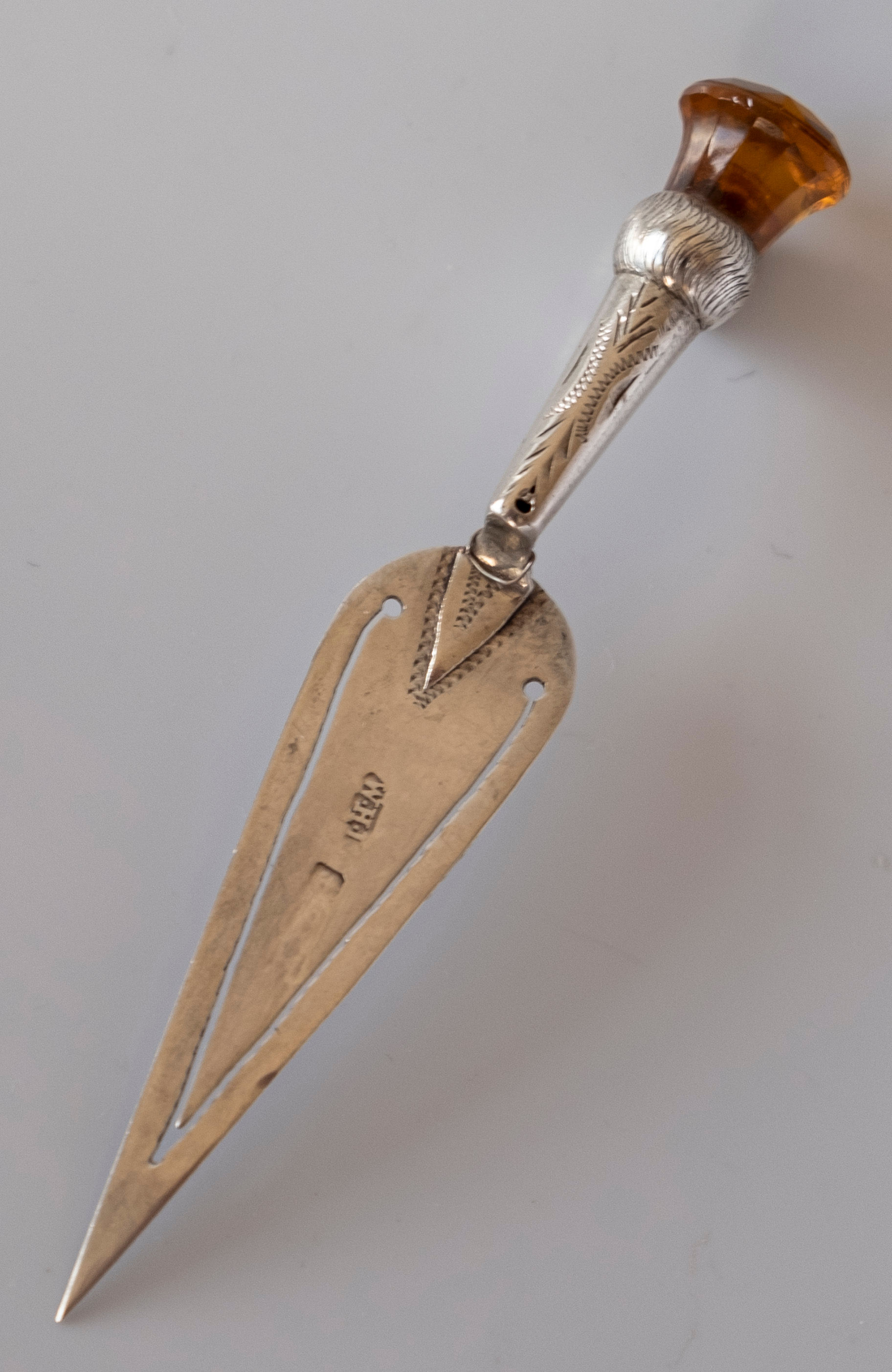 A trowel shape silver and paste stone thistle flower bookmark c1910