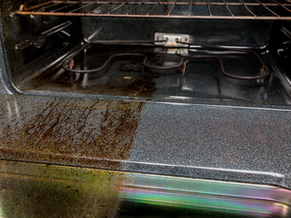What are the risks of not cleaning your oven?