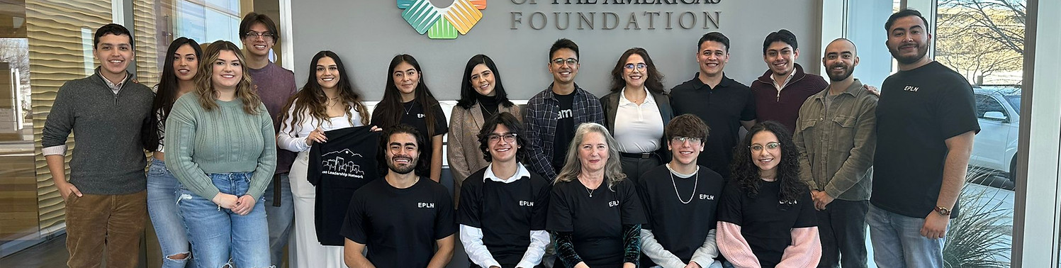 An image of a variety of smiling people posing for a group picture. Some have the EPLN shirt on.