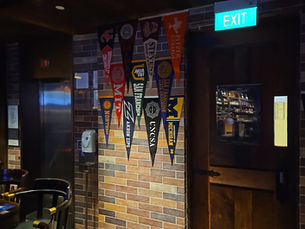 Bar with US universities' pennants