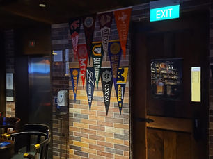 Bar with US universities' pennants
