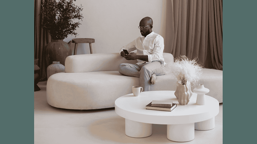 Modern living room with a stylish curved sofa, creating a soft, inviting seating arrangement perfect for contemporary homes.