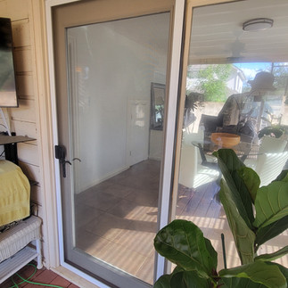 New heavy-duty insect sliding door screen installed on patio sliding glass door