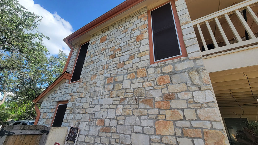 Solar window screens installed on side of two-story Austin home