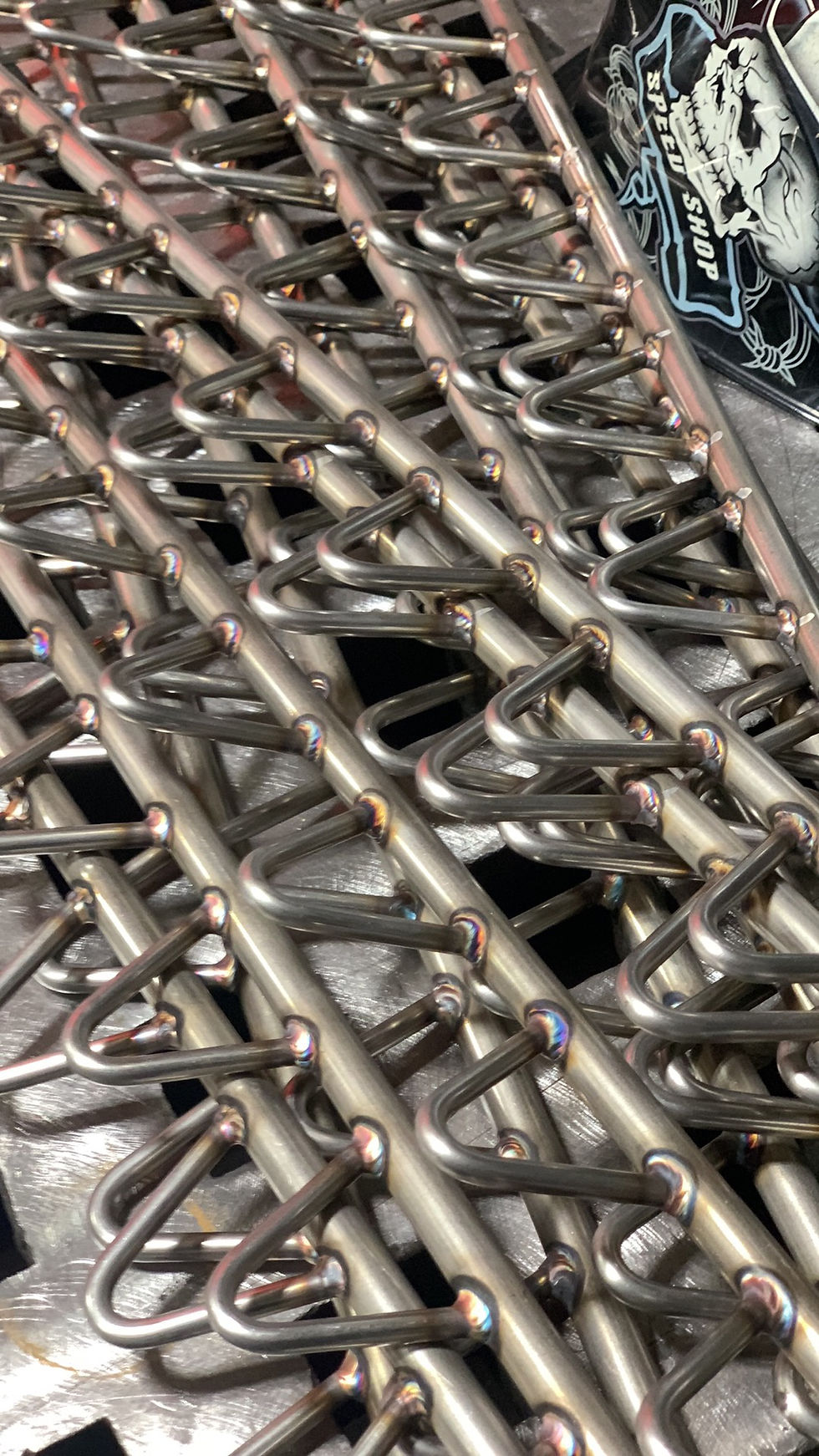 Parts for a SS hoist rack for a vapor degreaser machine.