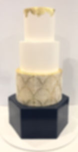 4 tier navy & gold wedding cake