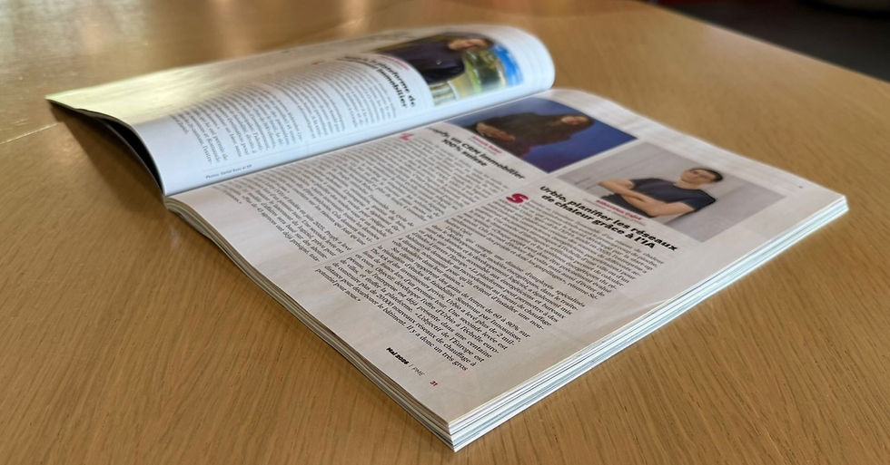 A picture of the physical edition of the magazine on a table, open to the page where Urbio is featured.