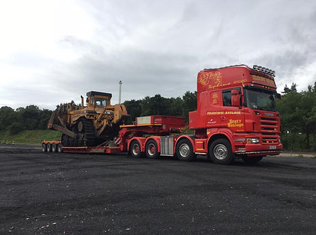 Lorry moving a Dozer