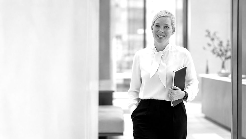 woman standing in office corridor