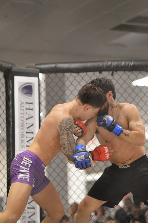 Isiel, personal trainer and MMA fighter, inside the cage during a mixed martial arts match