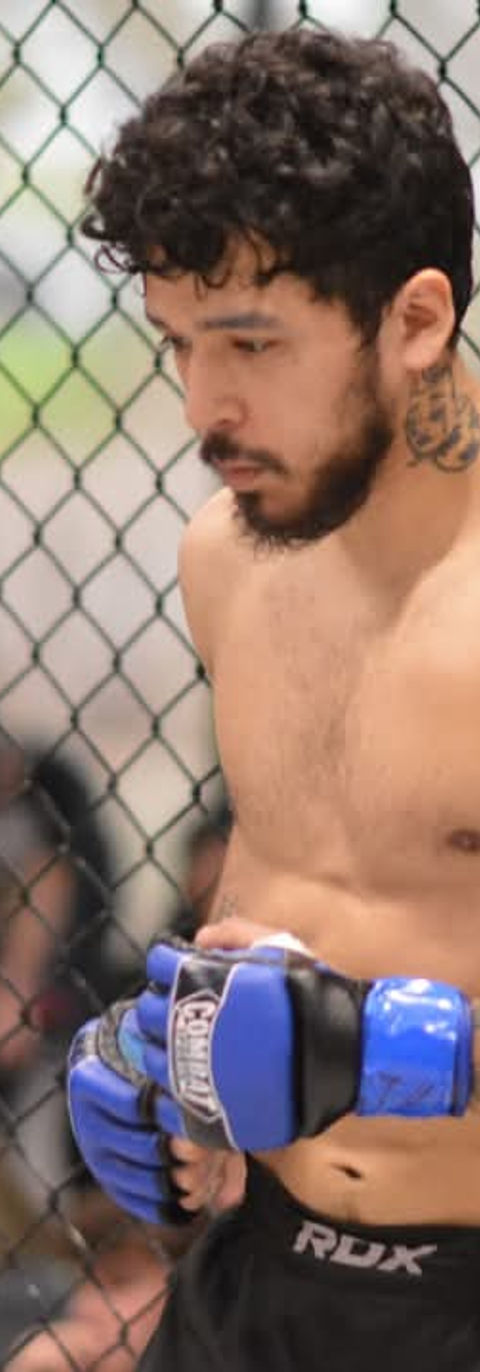 Isiel, personal trainer and MMA fighter, inside the cage during a mixed martial arts match