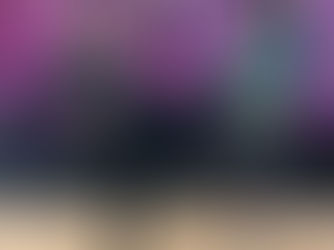 Seattle kickboxing class at Ampersand Fitness with trainer Esiel leading students through high-intensity pad work