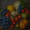 A Renaissance painting of fruits and vegetables; blueberries, lemon, grapes, cabbage, radi